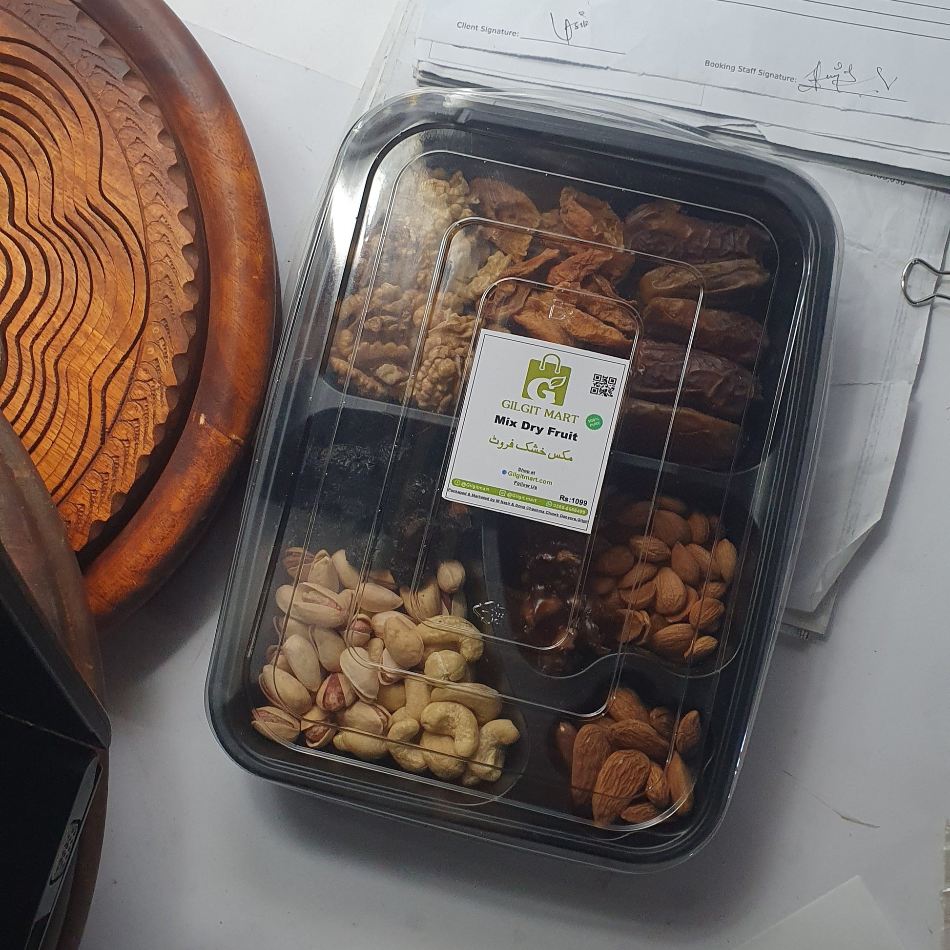 Premium mix dry fruit tray featuring organic apricots, cherries, walnuts, apricot kernels, almonds, pistachios, cashews, kilao, and dates, beautifully arranged for gifting or family sharing.